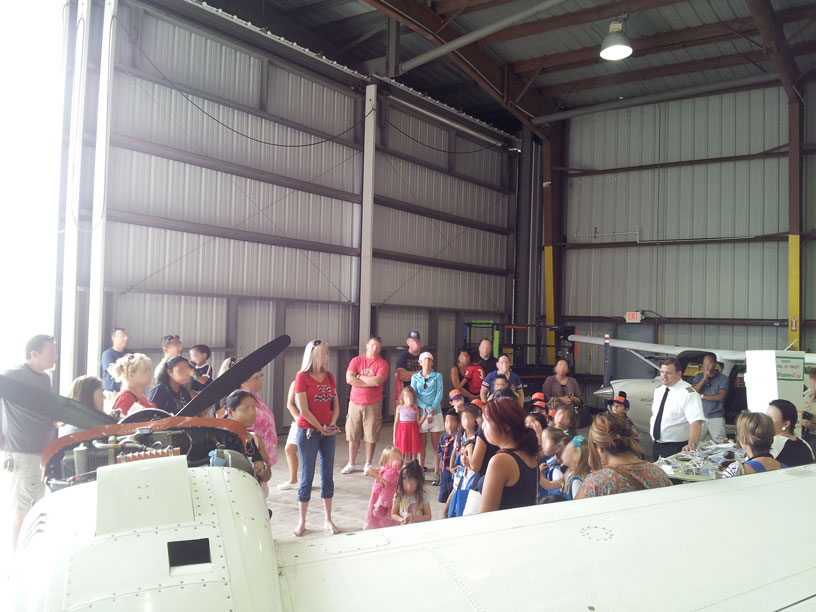View of group in airplane hangar