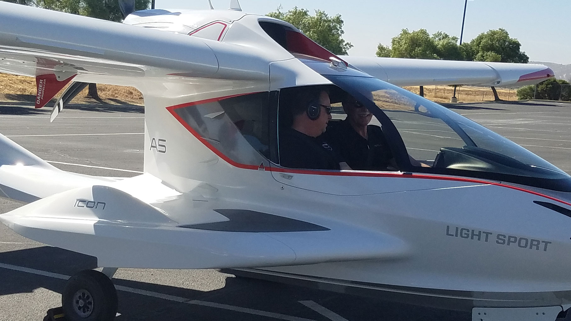 2 men inside ICON Aircraft plane